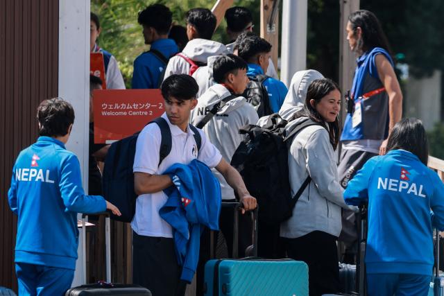 Members of Nepal's delegation arrive at the athletes' village ahead of the 2026 Asian Games in Nagoya, Aichi Prefecture on September 17, 2026. (Photo by DAVID GRAY / AFP)