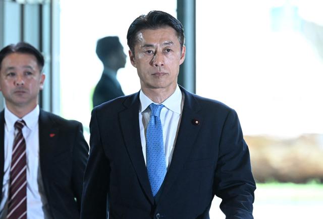 Newly-appointed Japanese Minister of Reconstruction Goshi Hosono arrives at the prime minister’s office in Tokyo on September 17, 2026, ahead of an expected cabinet reshuffle. (Photo by Rie KIKUCHI / AFP)