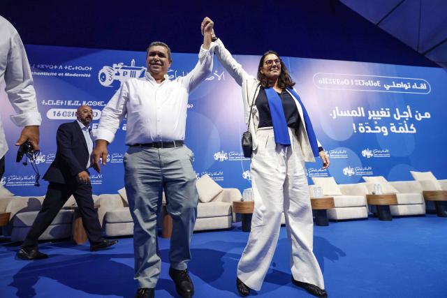 Secretary General of the Authenticity and Modernity Party (PAM) Fatima Ezzahra El Mansouri (R), who is also Morocco's Minister of National Planning, Urban Planning, Housing and Urban Policy and Mayor of Marrakesh, attends a party rally in Tangier on September 16, 2026, as part of PAM's electoral campaign ahead of Morocco's legislative elections, scheduled for September 23. Campaigning for Morocco's legislative election opened on September 10, with the governing coalition seeking to retain power amid discontent over economic and regional inequalities. The disparities are set to be a major issue in the vote, which will be held days before the first anniversary of a youth-led protest movement. (Photo by Abdel Majid BZIOUAT / AFP)