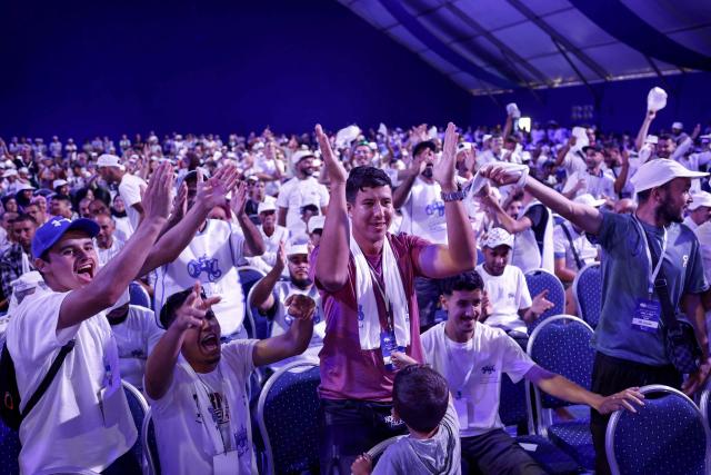 Members and supporters of the Authenticity and Modernity Party (PAM), cheer as they attend a party rally in Tangier on September 16, 2026, as part of PAM's electoral campaign ahead of Morocco's legislative elections, scheduled for September 23. Campaigning for Morocco's legislative election opened on September 10, with the governing coalition seeking to retain power amid discontent over economic and regional inequalities. The disparities are set to be a major issue in the vote, which will be held days before the first anniversary of a youth-led protest movement. (Photo by Abdel Majid BZIOUAT / AFP)