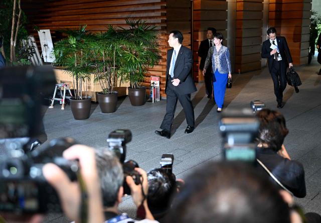 Japanese Prime Minister Sanae Takaichi (2nd R) leaves the Prime Minister’s Office to the Imperial Palace after her cabinet reshuffle in Tokyo on September 17, 2026. (Photo by Rie KIKUCHI / AFP)