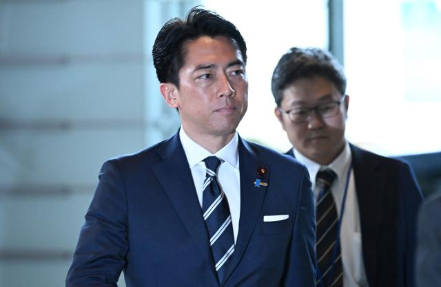 Reappointed Japanese Defence Minister Shinjiro Koizumi arrives at the prime minister’s office in Tokyo on September 17, 2026, ahead of an expected cabinet reshuffle. (Photo by Rie KIKUCHI / AFP)