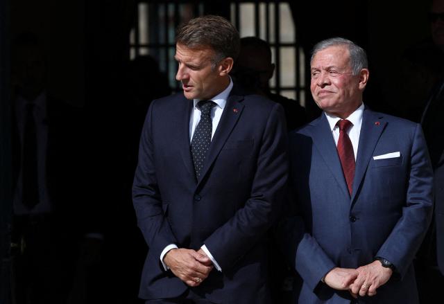 French President Emmanuel Macron (L) and Jordan's King Abdullah II (R) wait for the arrival of the Lebanese president before a trilateral meeting ahead of the opening of the "Aqaba Process" meeting in support of the Lebanese Armed Forces (LAF), at Hotel des Invalides in Paris, on September 17, 2026. The leaders of France, Lebanon and Jordan on September 17, 2026 met in  Paris to discuss international support for the cash-strapped Lebanese army and the creation of a new force to succeed a longstanding UN peacekeeping mission in southern Lebanon. (Photo by Gonzalo Fuentes / POOL / AFP)