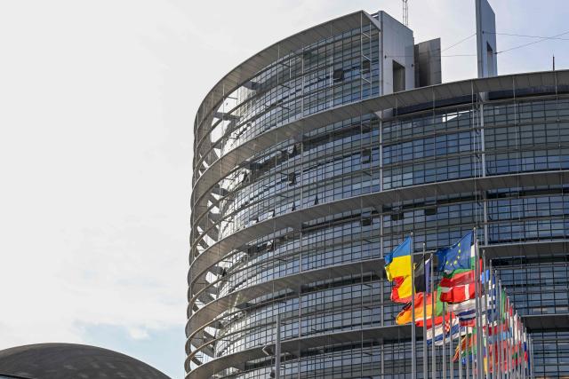 This photograph shows the European flag surrounded by the national flags of the EU member states flapping in the breeze in front of the Louise Weiss building, headquarters of the European Parliament, in Strasbourg, eastern France on September 17, 2026. (Photo by Jean-Christophe VERHAEGEN / AFP)