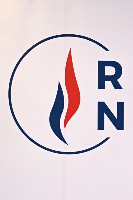 (FILES) This photograph taken in Paris on January 15, 2024 shows the logo of French far-right party ‘Rassemblement National’ (RN) displayed during RN president's New Year greetings. The annulment of the result of the municipal election in Montargis, central France, a victory won by the Rassemblement National (RN) in March, was recommended on September 17, 2026, by the public rapporteur before the administrative court of Orlйans, due to irregularities. (Photo by Bertrand GUAY / AFP)