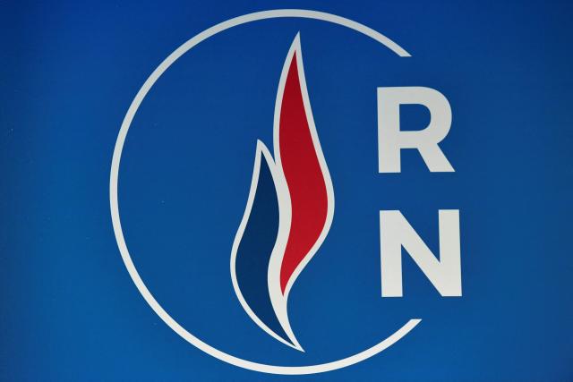 (FILES) French far-right party Rassemblement National's (RN) logo is pictured during the party's president's new-year wishes to the press on January 16, 2020 at the RN headquarters in Nanterre, near Paris. The annulment of the result of the municipal election in Montargis, central France, a victory won by the Rassemblement National (RN) in March, was recommended on September 17, 2026, by the public rapporteur before the administrative court of Orléans, due to irregularities. (Photo by Bertrand GUAY / AFP)