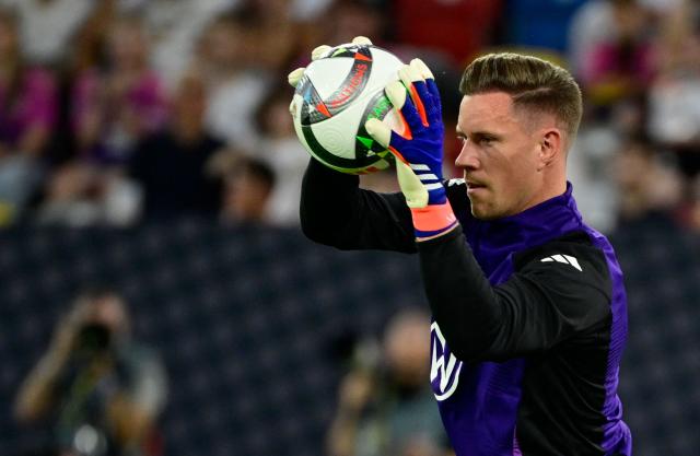 (FILES) Germany's goalkeeper #01 Marc-Andre Ter Stegen warms up with the ball prior to the League A Group A3 football match of the UEFA Nations League between Germany and Hungary in in Duesseldorf, western Germany, on September 7, 2024. Germany coach Jurgen Klopp handed 16 players their first call-ups on September 17, 2026 as he unveiled a 44-man squad for his first camp since taking over as coach in the summer. Marc-Andre ter Stegen will be Germany's number one option in goal. Ter Stegen left Barcelona for Ajax on a season-long loan in the summer after a torrid run of injuries which restricted him to just 12 competitive matches in the past two years. (Photo by John MACDOUGALL / AFP)
