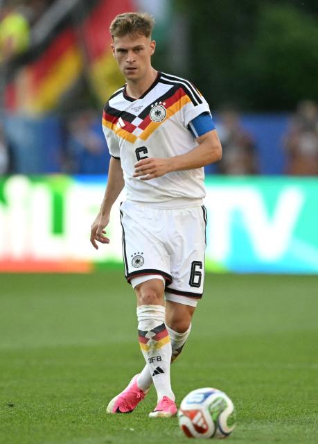(FILES) Germany's defender #06 Joshua Kimmich controls the ball during the 2026 World Cup round of 32 football match between Germany and Paraguay at the Boston Stadium in Foxborough on June 29, 2026. Germany coach Jurgen Klopp handed 16 players their first call-ups on September 17, 2026 as he unveiled a 44-man squad for his first camp since taking over as coach in the summer. Bayern midfielder Joshua Kimmich, the most experienced member of the squad with 114 caps, has retained the captain's armband. The 31-year-old is set to move from right-back to central midfield, where he plays at club level. (Photo by MAURO PIMENTEL / AFP)