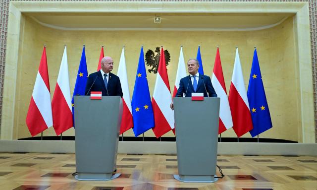 Polish Prime Minister Donald Tusk (R) and Austrian Chancellor Christian Stocker address a joint press conference in Warsaw on September 17, 2026. (Photo by ROLAND SCHLAGER / APA / AFP) / Austria OUT