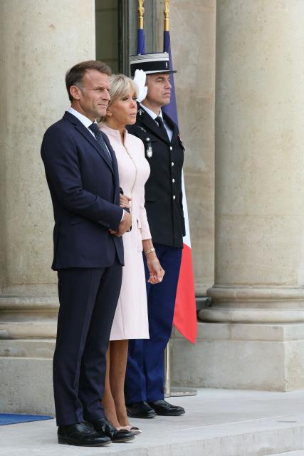 France's President Emmanuel Macron (L) and his wife Brigitte Macron await the arrival of Jordan's King Abdullah II and Jordan's Queen Rania ahead of their meeting at the Elysee Presidential Palace in Paris on September 17, 2026.  (Photo by Thomas SAMSON / AFP)