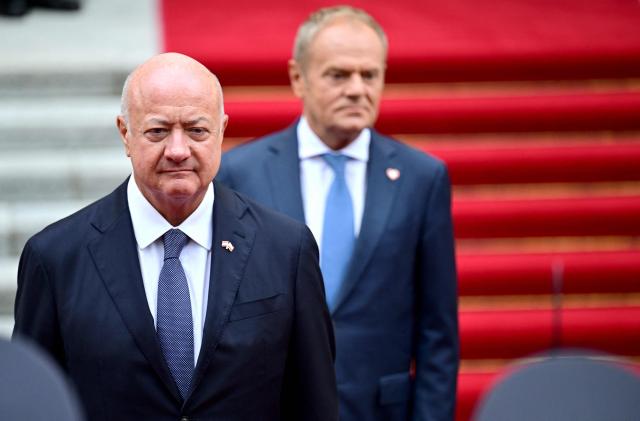 Polish Prime Minister Donald Tusk (back R) receives Austrian Chancellor Christian Stocker for a meeting in Warsaw on September 17, 2026. (Photo by ROLAND SCHLAGER / APA / AFP) / Austria OUT