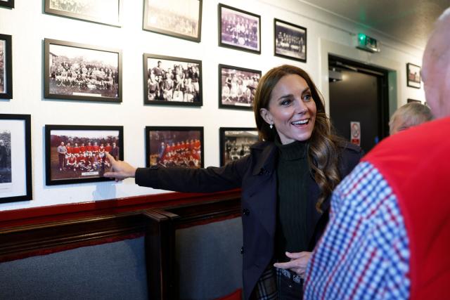 Britain's Catherine, Princess of Wales, meets representatives from the club's senior and youth teams, while visiting Bute Shinty Club in Rothesay, in the Isle of Bute, Scotland, on September 17, 2026. (Photo by Jeff J Mitchell / POOL / AFP)