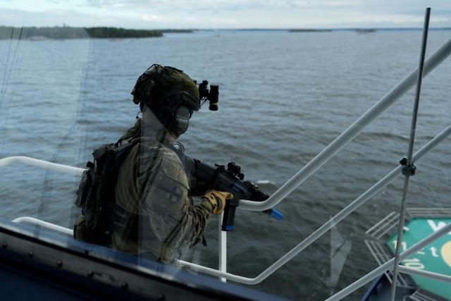 A Finnish soldier is seen aboard the Finnish icebreaking vessel Polaris, owned and operated by Finnish state-owned company Arctia, as members of Finnish Border Guard, Police and Armed Forces take part in the MARSEC EU 26 joint exercise hosted by the Finnish Border Guard off Helsinki in the Gulf of Finland, Finland on September 17, 2026. MARSEC EU 26 is the European Union's third annual maritime security exercise and is currently taking place in Finland. Hosted by the Finnish Border Guard and organised together with EU Member States and agencies, the exercise supports better coordination and information exchange. Special attention is given to protecting key underwater infrastructure, including cables and pipelines, and to dealing with suspicious maritime activity and potential hybrid threats. (Photo by Alessandro RAMPAZZO / AFP)