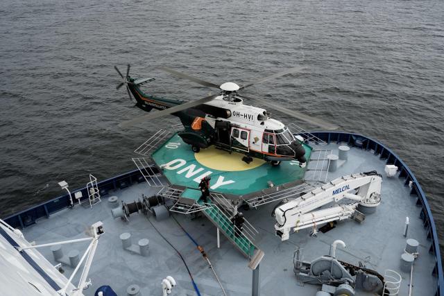 An Airbus Helicopter AS332L Super Puma of the Finnish Border Guard lands on the Finnish icebreaking vessel Polaris, owned and operated by Finnish state-owned company Arctia, as members of Finnish Border Guard, Police and Armed Forces take part in the MARSEC EU 26 joint exercise hosted by the Finnish Border Guard off Helsinki in the Gulf of Finland, Finland on September 17, 2026. MARSEC EU 26 is the European Union's third annual maritime security exercise and is currently taking place in Finland. Hosted by the Finnish Border Guard and organised together with EU Member States and agencies, the exercise supports better coordination and information exchange. Special attention is given to protecting key underwater infrastructure, including cables and pipelines, and to dealing with suspicious maritime activity and potential hybrid threats. (Photo by Alessandro RAMPAZZO / AFP)
