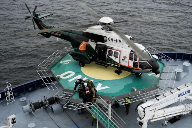 An Airbus Helicopter AS332L Super Puma of the Finnish Border Guard lands on the Finnish icebreaking vessel Polaris, owned and operated by Finnish state-owned company Arctia, as members of Finnish Border Guard, Police and Armed Forces take part in the MARSEC EU 26 joint exercise hosted by the Finnish Border Guard off Helsinki in the Gulf of Finland, Finland on September 17, 2026. MARSEC EU 26 is the European Union's third annual maritime security exercise and is currently taking place in Finland. Hosted by the Finnish Border Guard and organised together with EU Member States and agencies, the exercise supports better coordination and information exchange. Special attention is given to protecting key underwater infrastructure, including cables and pipelines, and to dealing with suspicious maritime activity and potential hybrid threats. (Photo by Alessandro RAMPAZZO / AFP)