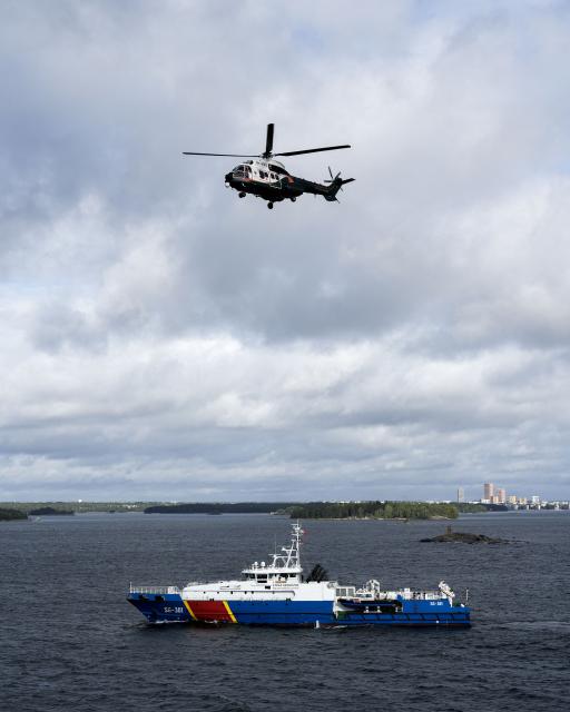 An Airbus Helicopter OH-HVG AS332L Super Puma of the Finnish Border Guard flies over the Polish Border Guard vessel Straz Graniczna as members of Finnish Border Guard, Police and Armed Forces take part in the MARSEC EU 26 joint exercise hosted by the Finnish Border Guard off Helsinki in the Gulf of Finland, Finland on September 17, 2026. MARSEC EU 26 is the European Union's third annual maritime security exercise and is currently taking place in Finland. Hosted by the Finnish Border Guard and organised together with EU Member States and agencies, the exercise supports better coordination and information exchange. Special attention is given to protecting key underwater infrastructure, including cables and pipelines, and to dealing with suspicious maritime activity and potential hybrid threats. (Photo by Alessandro RAMPAZZO / AFP)