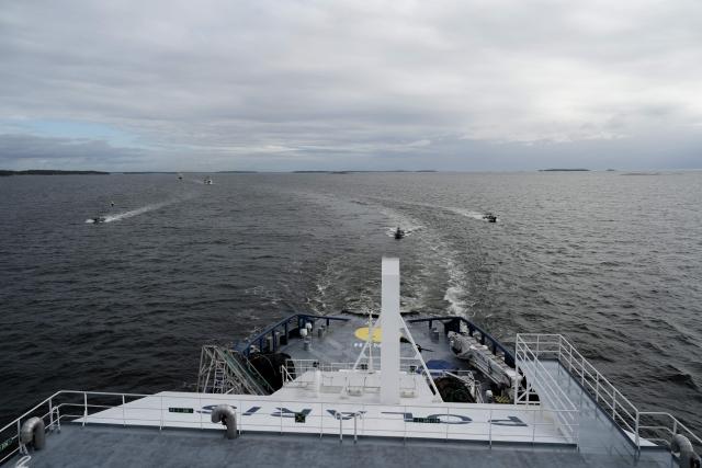 Vessels approach the Finnish icebreaking vessel Polaris, owned and operated by Finnish state-owned company Arctia, as members of Finnish Border Guard, Police and Armed Forces take part in the MARSEC EU 26 joint exercise hosted by the Finnish Border Guard off Helsinki in the Gulf of Finland, Finland on September 17, 2026. MARSEC EU 26 is the European Union's third annual maritime security exercise and is currently taking place in Finland. Hosted by the Finnish Border Guard and organised together with EU Member States and agencies, the exercise supports better coordination and information exchange. Special attention is given to protecting key underwater infrastructure, including cables and pipelines, and to dealing with suspicious maritime activity and potential hybrid threats. (Photo by Alessandro RAMPAZZO / AFP)