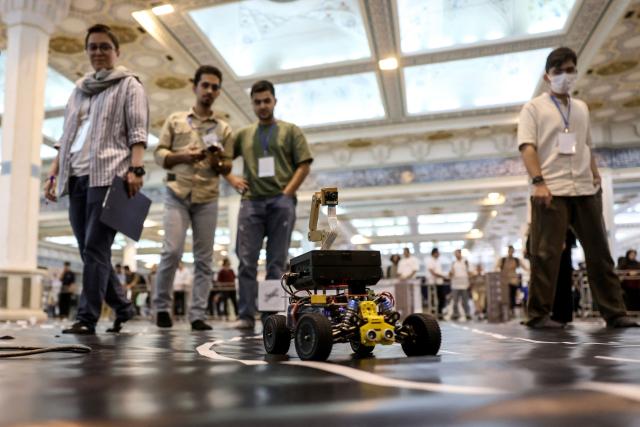 Iranian students take part in the RoboCup IranOpen event at Tehran's Mosallah Mosque on September 17, 2026. (Photo by AFP)