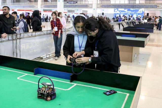 Iranian students take part in the RoboCup IranOpen event at Tehran's Mosallah Mosque on September 17, 2026. (Photo by AFP)