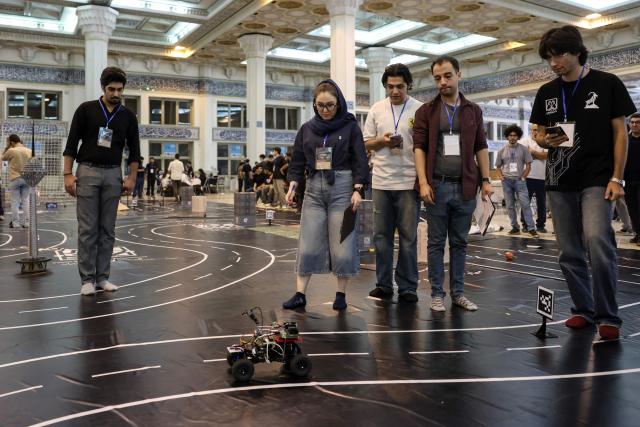 Iranian students take part in the RoboCup IranOpen event at Tehran's Mosallah Mosque on September 17, 2026. (Photo by AFP)