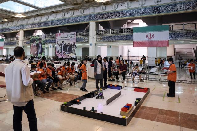 Iranian students take part in the RoboCup IranOpen event at Tehran's Mosallah Mosque on September 17, 2026. (Photo by AFP)