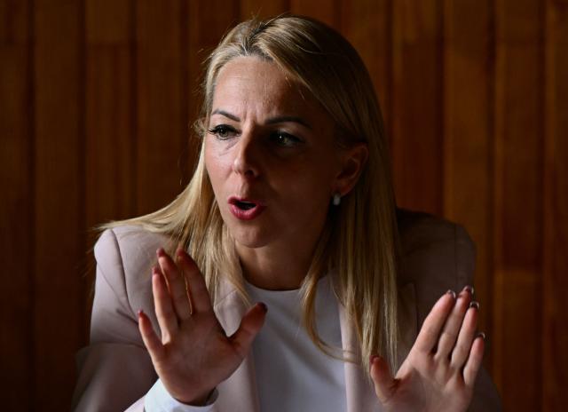 French MP of the far-right Rassemblement National (RN) group Edwige Diaz looks on during a visit of her party's 2027 French presidential candidate in Le Porge, south-western France, on September 17, 2026, months after a wildfire destroyed some 183 homes in the town as part of a broader blaze that swept through the Gironde department this summer. The National Rally is making Gironde, where Marine Le Pen is visiting on September 17, 2026, a key step in its bid to gain a foothold in the Senate. In 2020, the Green candidate was elected there, a first in the region, far ahead of the National Rallys candidate, Edwige Diaz. Six years later, the vote on September 27 is looking bleak for the Greens, who have lost grand electors, unlike the far right. (Photo by Philippe LOPEZ / AFP)