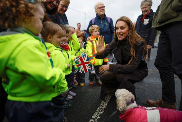 Britain's Catherine, Princess of Wales (R) meets young members of the public outside, after visiting the community-owned Anchor Tavern Pub & Hub in Port Bannatyne in the Isle of Bute, Scotland, September 17, 2026. (Photo by Jeff J Mitchell / POOL / AFP)