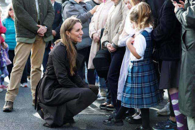 Britain's Catherine, Princess of Wales (L) meets young members of the public outside, after visiting the community-owned Anchor Tavern Pub & Hub in Port Bannatyne in the Isle of Bute, Scotland, September 17, 2026. (Photo by Jeff J Mitchell / POOL / AFP)