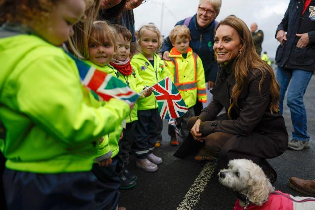 Britain's Catherine, Princess of Wales (R) meets young members of the public outside, after visiting the community-owned Anchor Tavern Pub & Hub in Port Bannatyne in the Isle of Bute, Scotland, September 17, 2026. (Photo by Jeff J Mitchell / POOL / AFP)