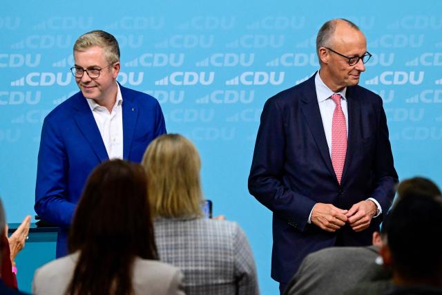 The conservative Christian Democratic Union (CDU) party's lead candidate for the Berlin state election, Stefan Evers (L) and German Chancellor and leader of Germany's Christian Democratic Union (CDU) Friedrich Merz acknowledge the applauds during a campaign event at the CDU headquarters in Berlin, on September 17, 2026. Berlin's State elections take place on September 20, 2026. (Photo by John MACDOUGALL / AFP)