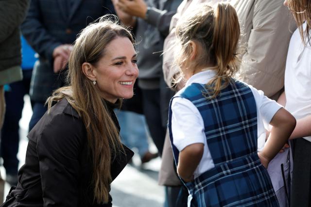Britain's Catherine, Princess of Wales (L) meets young members of the public outside, after visiting the community-owned Anchor Tavern Pub & Hub in Port Bannatyne in the Isle of Bute, Scotland, September 17, 2026. (Photo by Jeff J Mitchell / POOL / AFP)