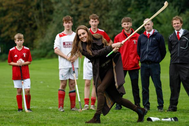 Britain's Catherine (C), Princess of Wales, participates in the sport on the pitch, while visiting Bute Shinty Club in Rothesay, in the Isle of Bute, Scotland, on September 17, 2026. (Photo by Jeff J Mitchell / POOL / AFP)
