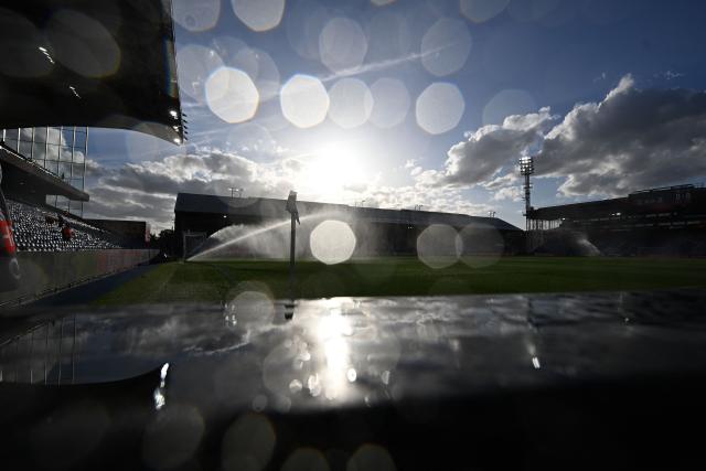 Sprinklers water the picth ahead of the UEFA Europa League, League phase football match between Crystal Palace and Lech Poznan at Selhurst Park in London on September 17, 2026. (Photo by Glyn KIRK / AFP)