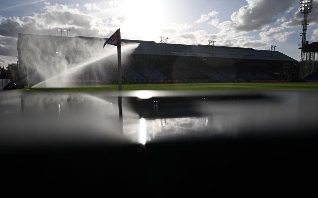 Sprinklers water the picth ahead of the UEFA Europa League, League phase football match between Crystal Palace and Lech Poznan at Selhurst Park in London on September 17, 2026. (Photo by Glyn KIRK / AFP)