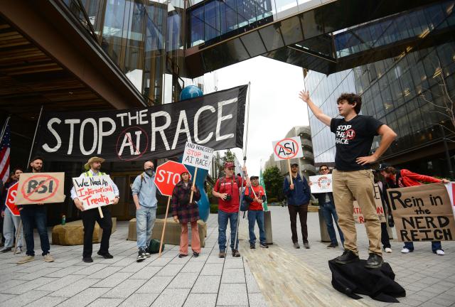 Protesters during a "Stop the AI Race" demonstration calling for a slowdown in the development of advanced artificial intelligence systems in San Francisco, California, on September 17, 2026. The world's biggest AI companies are working on creating a standards body, ChatGPT-maker OpenAI said on September 15, as fears rise about the dangers of AI and pressure is on to create a safer version of the technology. US President Donald Trump has dismissed warnings about the risks of AI as "hoaxes." (Photo by Karl Mondon / AFP)