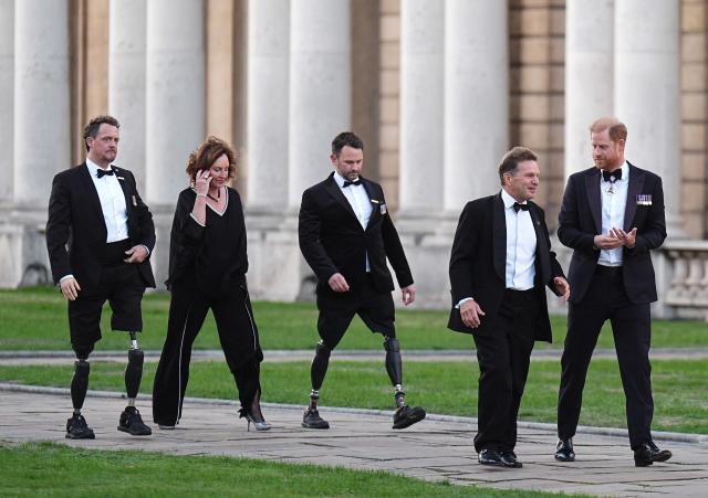 Britain's Prince Harry, Duke of Sussex (R) walks with Britain's Prince Harry, Duke of Sussex meets Invictus CEO Rob Owen, as her arrives to attend the inaugural Invictus Spirit Awards at the Old Royal Naval College in Greenwich, south-east London on September 17, 2026. (Photo by Aaron Chown / POOL / AFP)