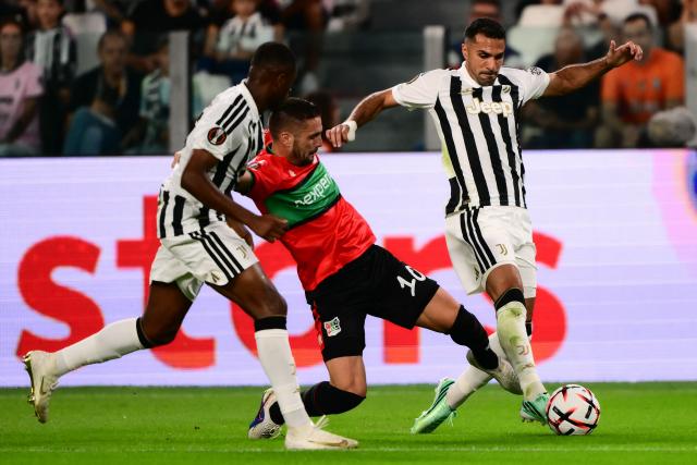 NEC Nijmegen’s Serbian forward #10 Dusan Tadic (C) fights for the ball with Juventus’ Turkish defender #02 Zeki Celik (R) during the UEFA Europa League 1st round day 1 football match between Juventus and NEC Nijmegen at the Allianz Stadium in Turin on September 17, 2026. (Photo by Marco Bertorello / AFP)