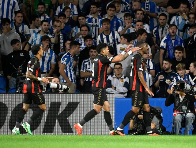 Bournemouth's Brazilian forward #37 Rayan Rocha (R) celebrates with teammates scoring his team's second goal during the UEFA Europa League 1st round day 1 football match between Real Sociedad and AFC Bournemouth at Anoeta Stadium in San Sebastian on September 17, 2026. (Photo by ANDER GILLENEA / AFP)