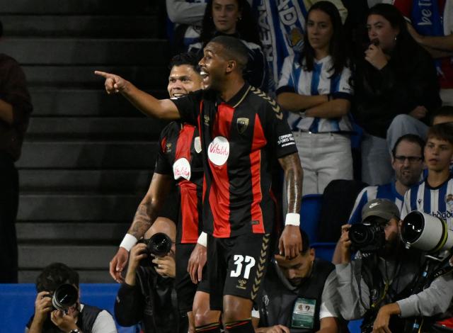 Bournemouth's Brazilian forward #37 Rayan Rocha (R) celebrates with teammates scoring his team's second goal during the UEFA Europa League 1st round day 1 football match between Real Sociedad and AFC Bournemouth at Anoeta Stadium in San Sebastian on September 17, 2026. (Photo by ANDER GILLENEA / AFP)
