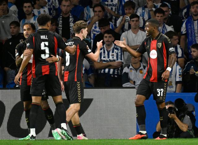 Bournemouth's Brazilian forward #37 Rayan Rocha (R) celebrates with teammates scoring his team's second goal during the UEFA Europa League 1st round day 1 football match between Real Sociedad and AFC Bournemouth at Anoeta Stadium in San Sebastian on September 17, 2026. (Photo by ANDER GILLENEA / AFP)