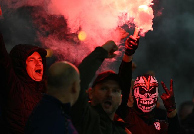 Lech Poznan fans let off flares during the UEFA Europa League, League phase football match between Crystal Palace and Lech Poznan at Selhurst Park in London on September 17, 2026. (Photo by Glyn KIRK / AFP)
