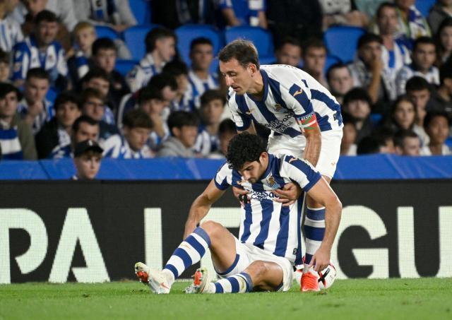Real Sociedad's Spanish forward #10 Mikel Oiarzabal lifts Real Sociedad's Portuguese forward #11 Goncalo Guedes during the UEFA Europa League 1st round day 1 football match between Real Sociedad and AFC Bournemouth at Anoeta Stadium in San Sebastian on September 17, 2026. (Photo by ANDER GILLENEA / AFP)