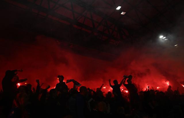 Lech Poznan fans let off flares during the UEFA Europa League, League phase football match between Crystal Palace and Lech Poznan at Selhurst Park in London on September 17, 2026. (Photo by Glyn KIRK / AFP)