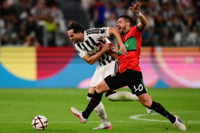 Juventus’ Italian defender #4 Federico Gatti (L) fights for the ball with NEC Nijmegen’s Serbian forward #10 Dusan Tadic during the UEFA Europa League 1st round day 1 football match between Juventus and NEC Nijmegen at the Allianz Stadium in Turin on September 17, 2026. (Photo by Marco Bertorello / AFP)