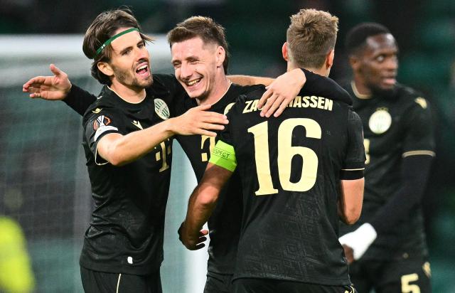 Ferencvaros players celebrate at the end of the UEFA Europa League, League phase football match between Celtic and Ferencvaros at Celtic Park in Glasgow on September 17, 2026. (Photo by ANDY BUCHANAN / AFP)