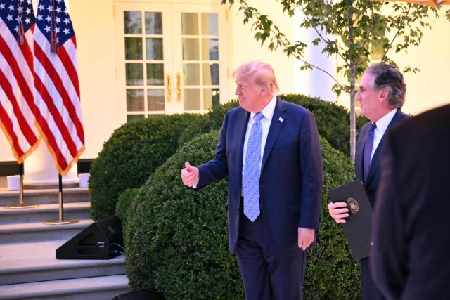US President Donald Trump is joined by the US Secretary of the Interior Doug Burgum for a Rose Garden dinner at the White House in Washington, DC, on September 17, 2026. (Photo by Mandel NGAN / AFP)