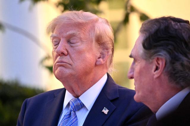 US President Donald Trump listens to the US Secretary of the Interior Doug Burgum during a Rose Garden dinner at the White House in Washington, DC, on September 17, 2026. (Photo by Mandel NGAN / AFP)