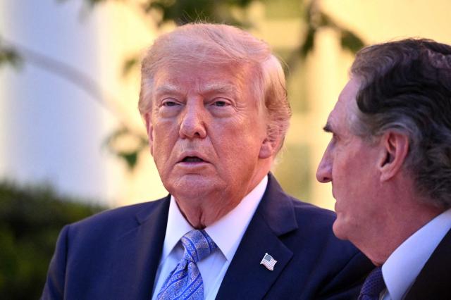 US President Donald Trump speaks with the US Secretary of the Interior Doug Burgum during a Rose Garden dinner at the White House in Washington, DC, on September 17, 2026. (Photo by Mandel NGAN / AFP)