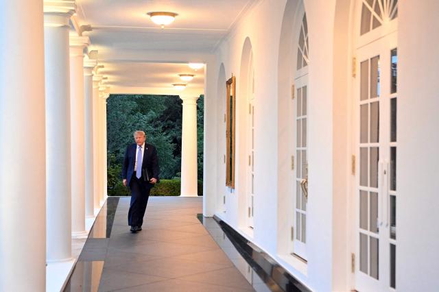 US President Donald Trump walks through the Colonnade on his way to attend a Rose Garden dinner at the White House in Washington, DC, on September 17, 2026. (Photo by Mandel NGAN / AFP)