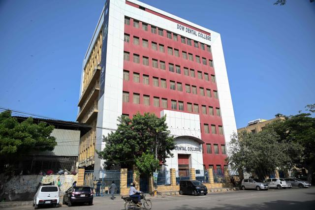 An exterior view of the Dow Dental College is seen in Karachi on September 17, 2026. Dozens of Afghans studying to be doctors in Pakistan hope a court hearing on September 18 will overturn an order by the country's medical board for them to be expelled from colleges and universities and sent home. (Photo by Rizwan TABASSUM / AFP)